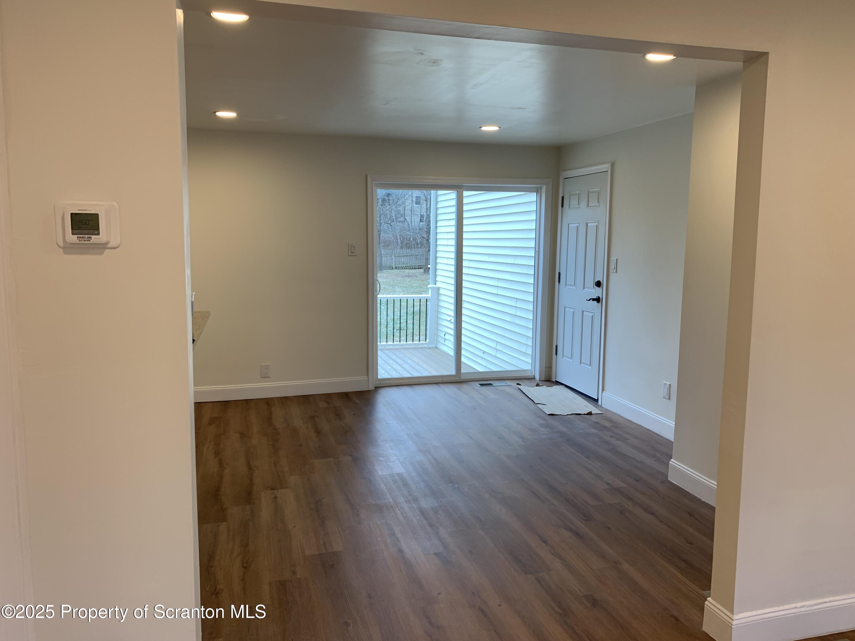 318 Simrell Road Clarks Summit, PA 18411 - Photo 15 of 30 a view of an empty room with wooden floor and closet