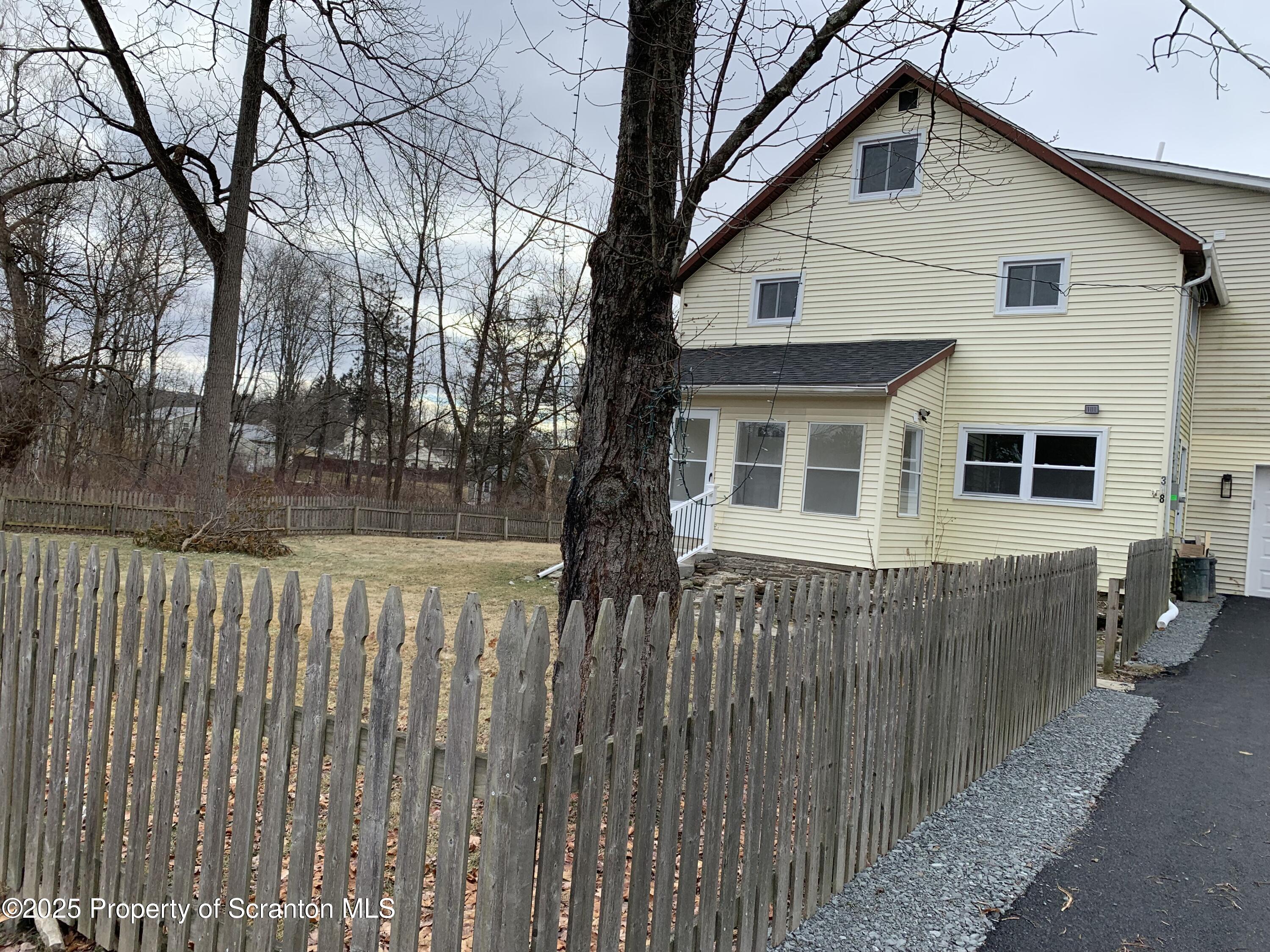 318 Simrell Road Clarks Summit, PA 18411 - Photo 7 of 30 a front view of a house with a yard