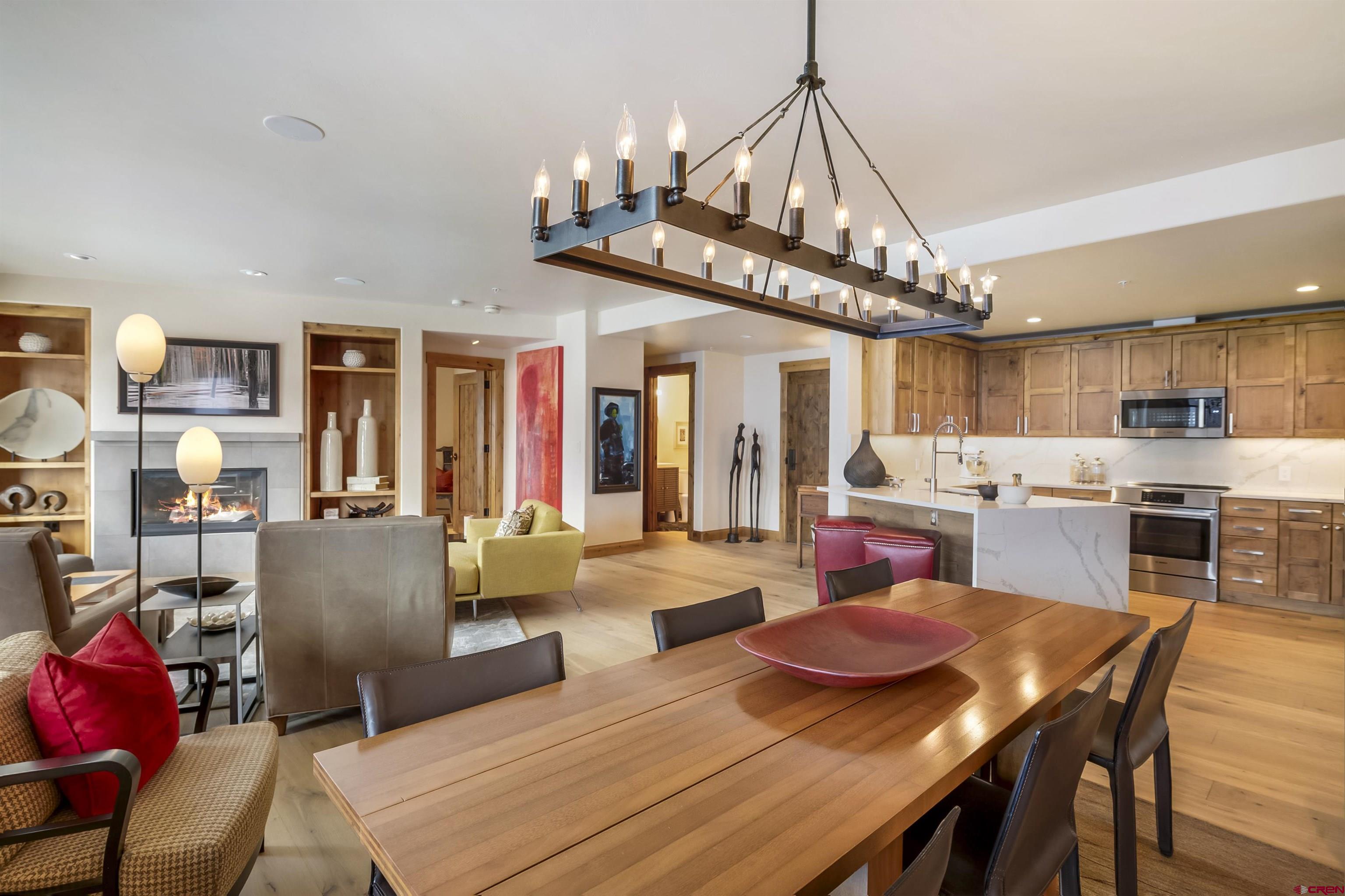14 Hunter Hill Road, Unit A204 Crested Butte, CO 81225 - Photo 12 of 36 a view of a dining room with furniture and a chandelier