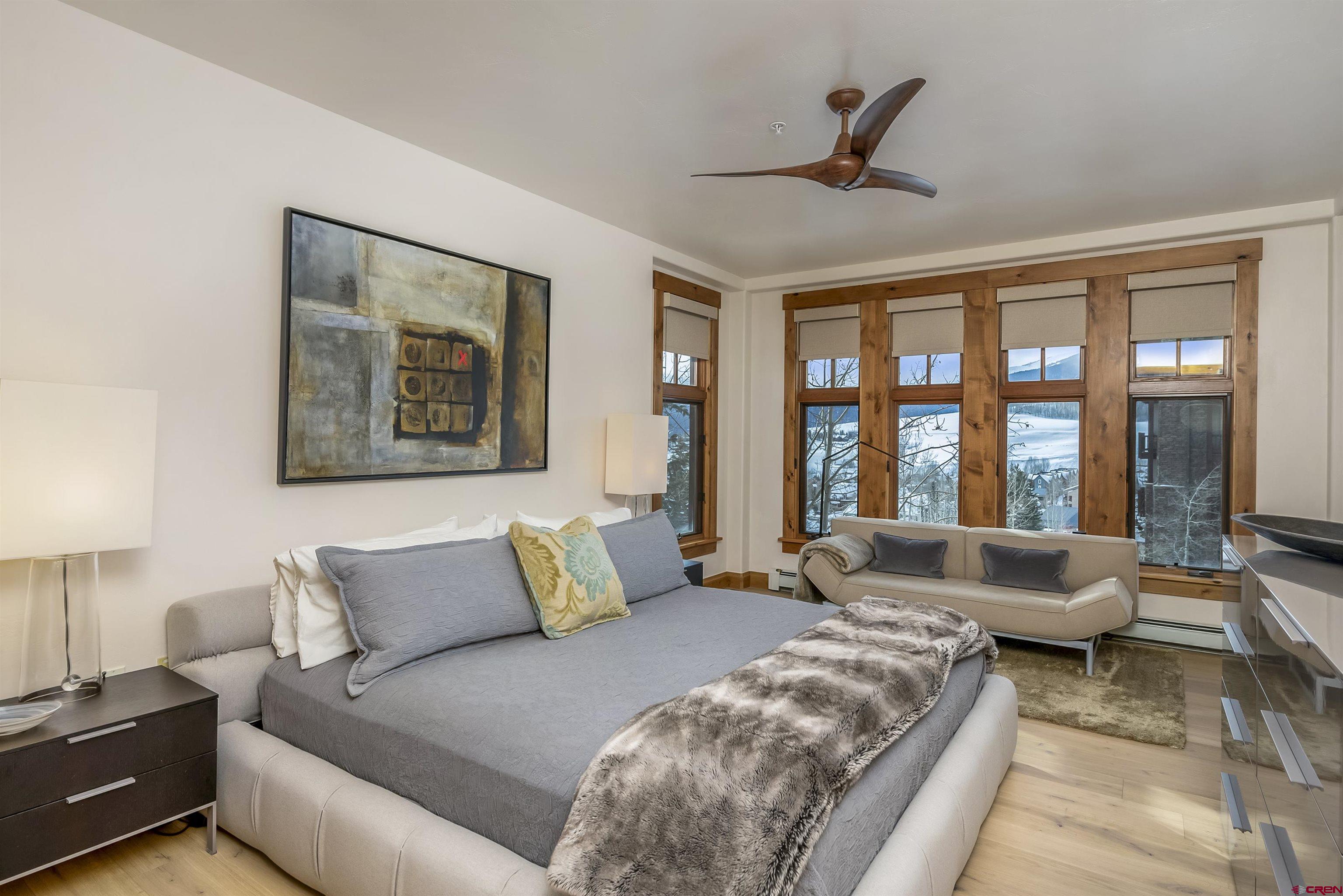 14 Hunter Hill Road, Unit A204 Crested Butte, CO 81225 - Photo 16 of 36 a living room with furniture and floor to ceiling windows