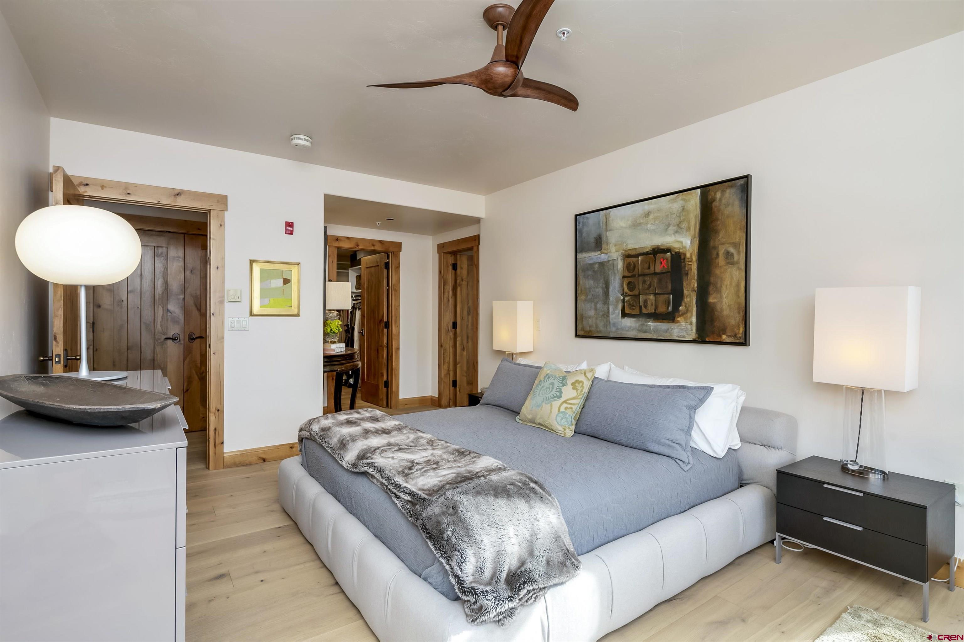 14 Hunter Hill Road, Unit A204 Crested Butte, CO 81225 - Photo 17 of 36 a bedroom with a bed and a lamp