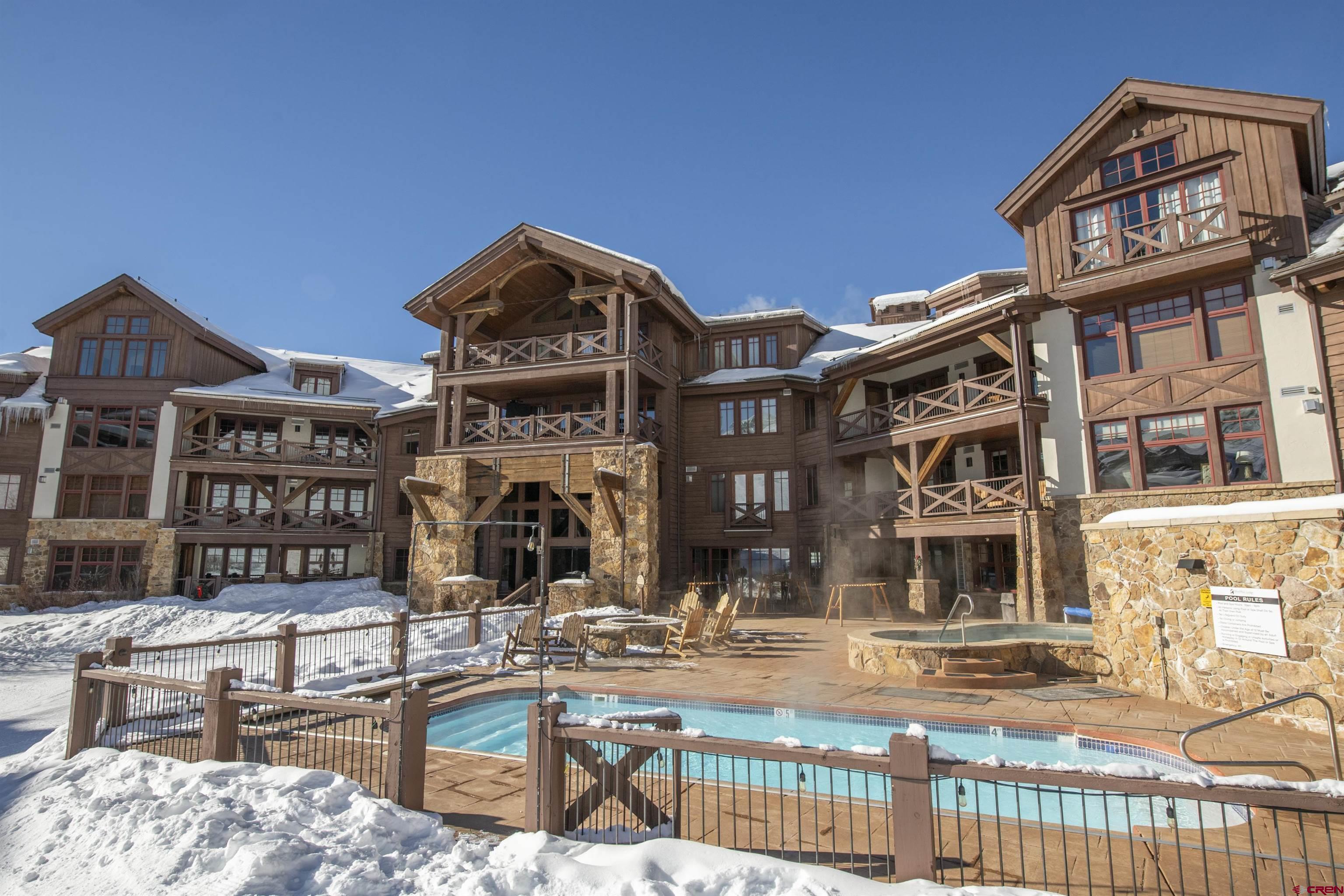 14 Hunter Hill Road, Unit A204 Crested Butte, CO 81225 - Photo 30 of 36 a front view of a building with street view