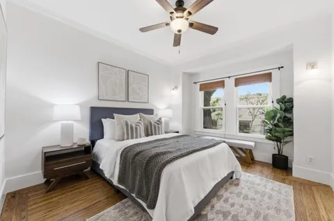 a bed room with a bed and a window