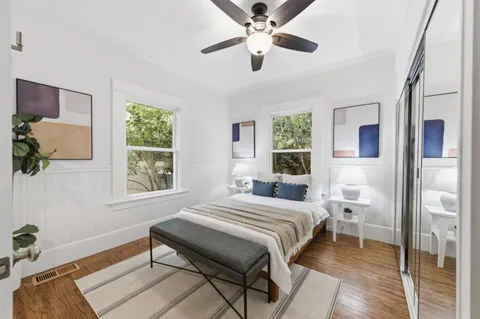 a bedroom with a bed and a window