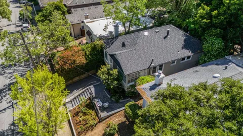 an aerial view of house with a yard and swimming pool