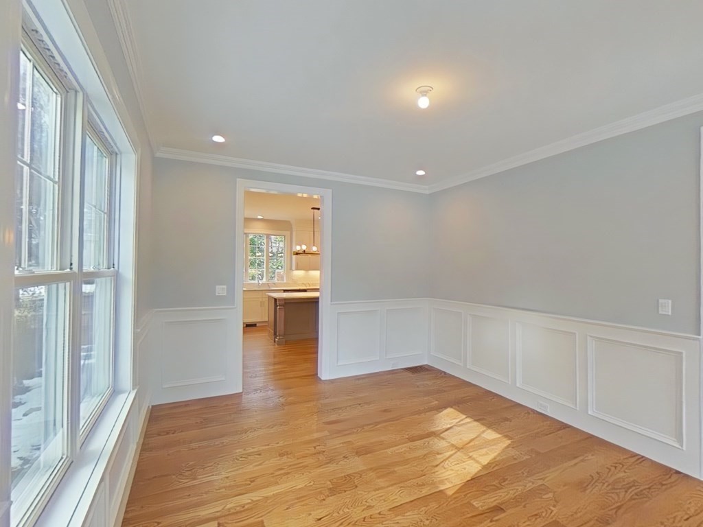 65 Emerson Road Needham, MA 02492 - Photo 14 of 37 a view of an empty room with wooden floor and a window