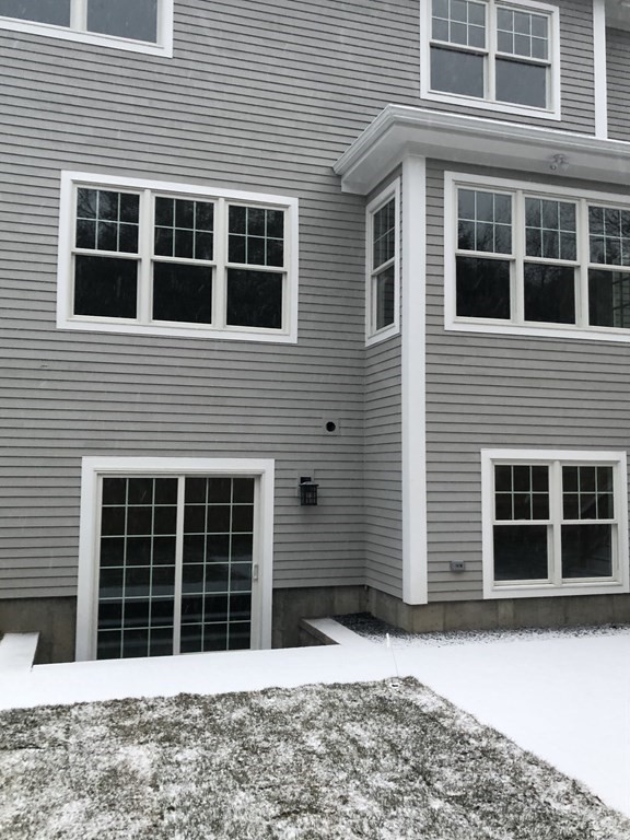 65 Emerson Road Needham, MA 02492 - Photo 34 of 37 a view of a house with a backyard