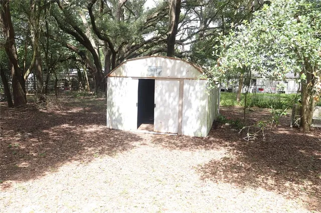 a view of a house with a snow in the yard