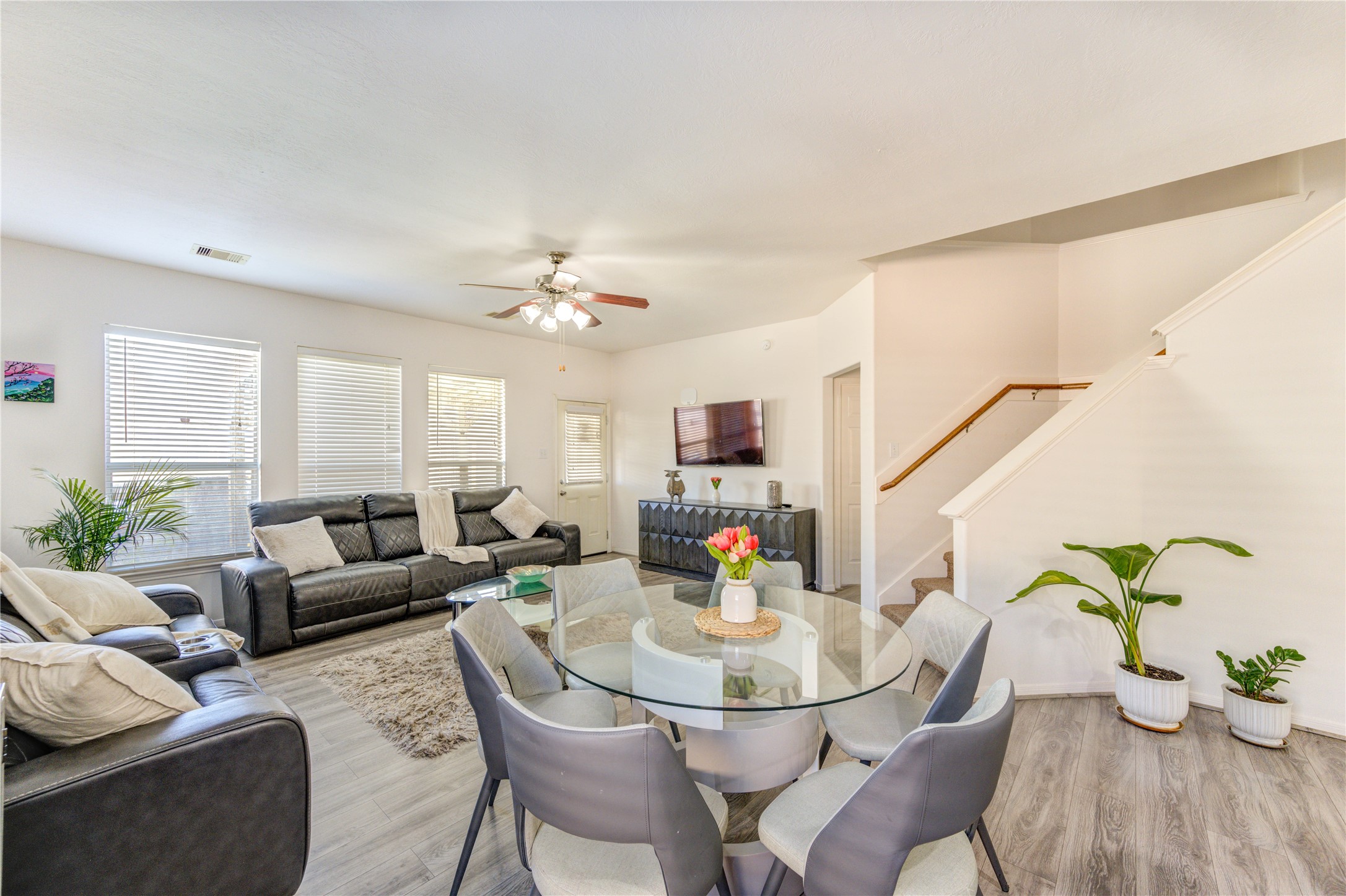 25210 Hazel Ranch Drive Katy, TX 77494 - Photo 13 of 45 a living room with furniture and a dining table with kitchen view
