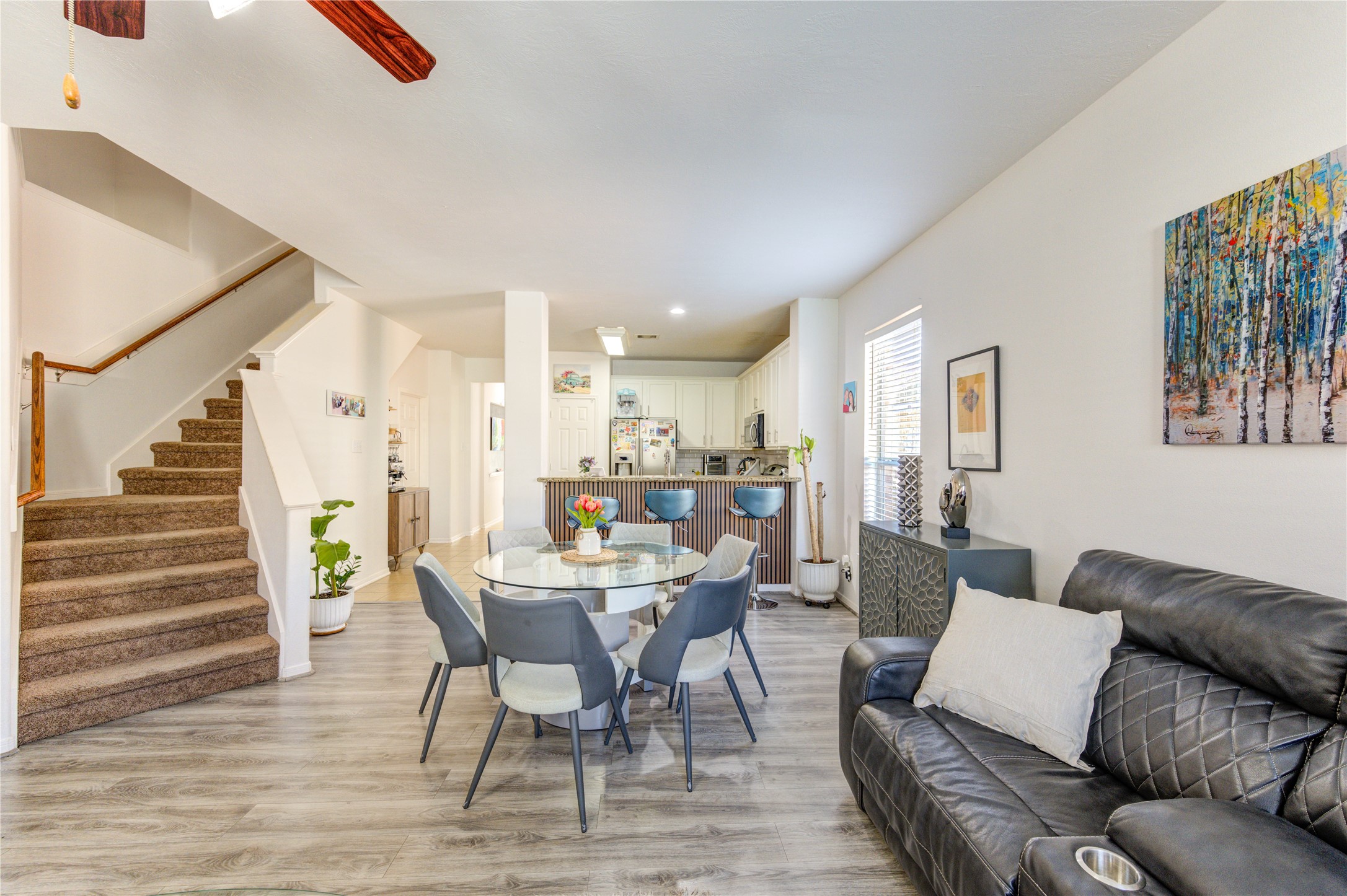 25210 Hazel Ranch Drive Katy, TX 77494 - Photo 16 of 45 a view of a dining room with furniture and wooden floor