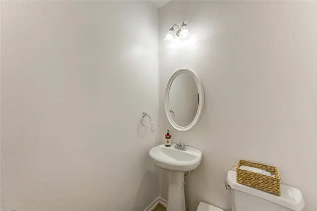 a bedroom with bed and wooden floor