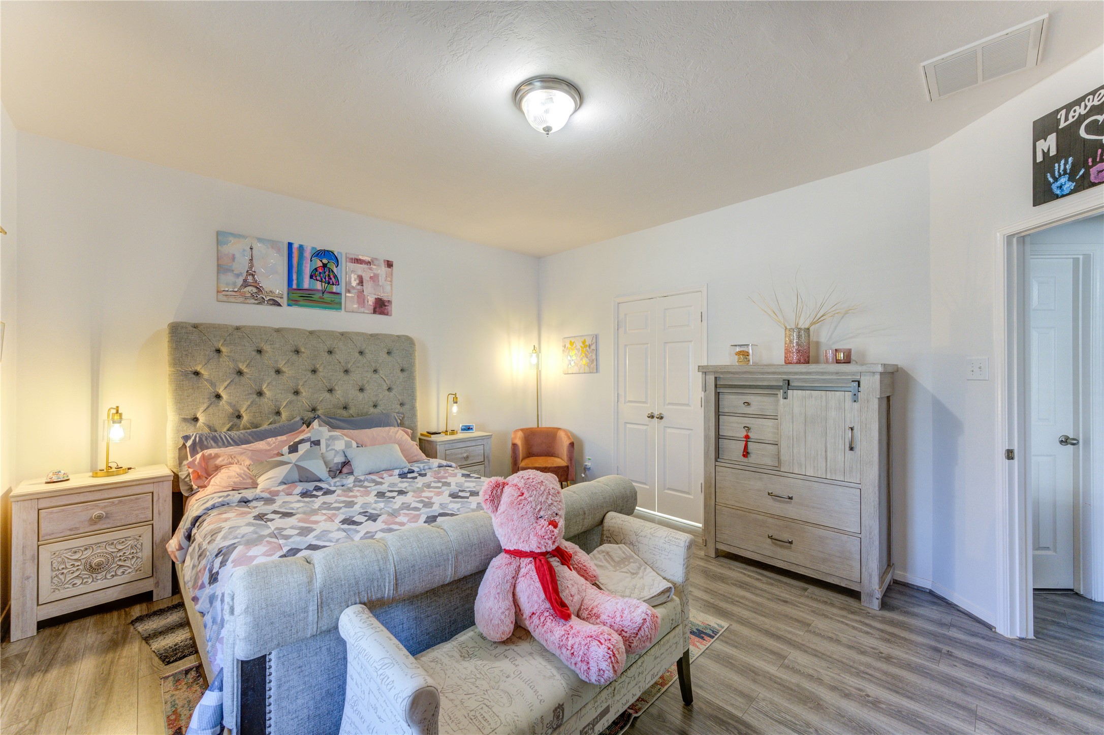 25210 Hazel Ranch Drive Katy, TX 77494 - Photo 20 of 45 a bedroom with a bed and wooden floor