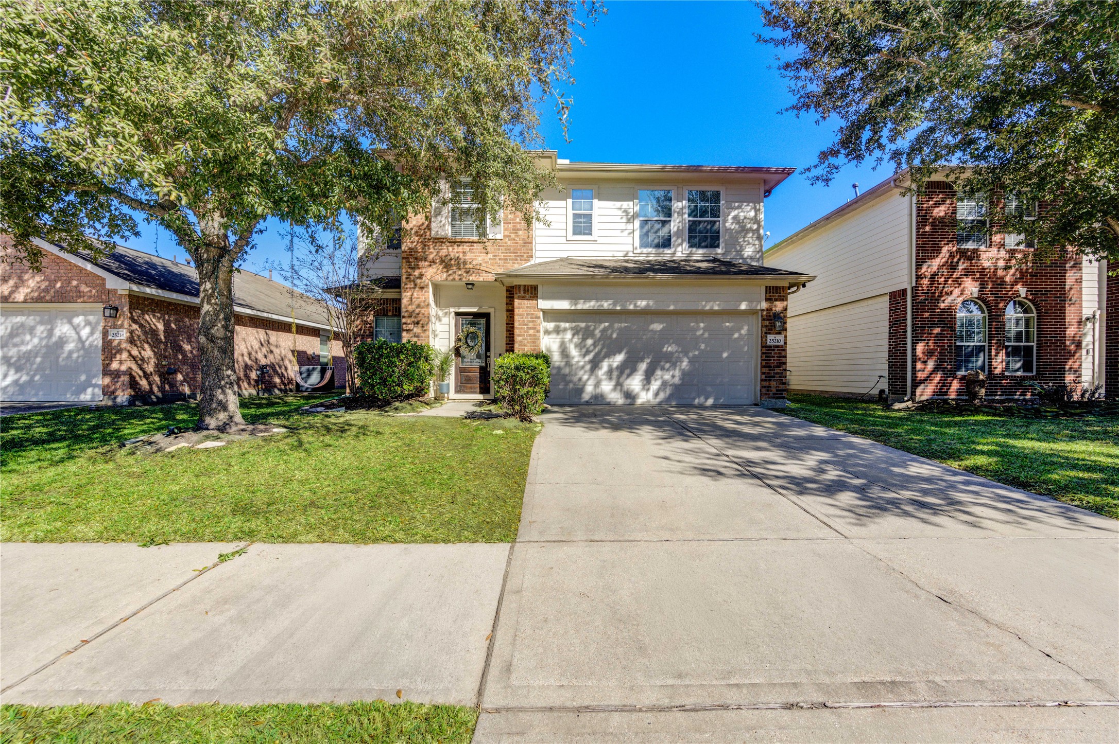 25210 Hazel Ranch Drive Katy, TX 77494 - Photo 2 of 45 a view of a front of a house with a yard