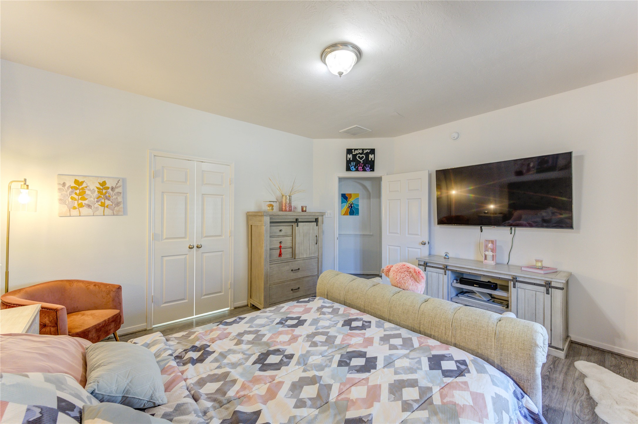 25210 Hazel Ranch Drive Katy, TX 77494 - Photo 21 of 45 a bedroom with a bed and a flat screen tv