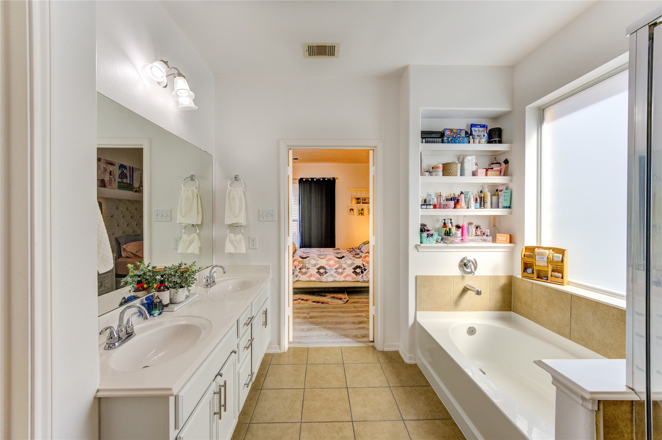 25210 Hazel Ranch Drive Katy, TX 77494 - Photo 22 of 45 a bathroom with a tub sink and mirror
