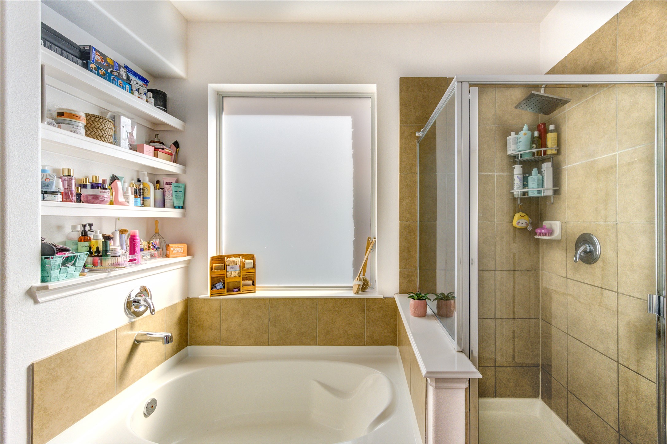 25210 Hazel Ranch Drive Katy, TX 77494 - Photo 23 of 45 a bathroom with a tub a sink and a shower