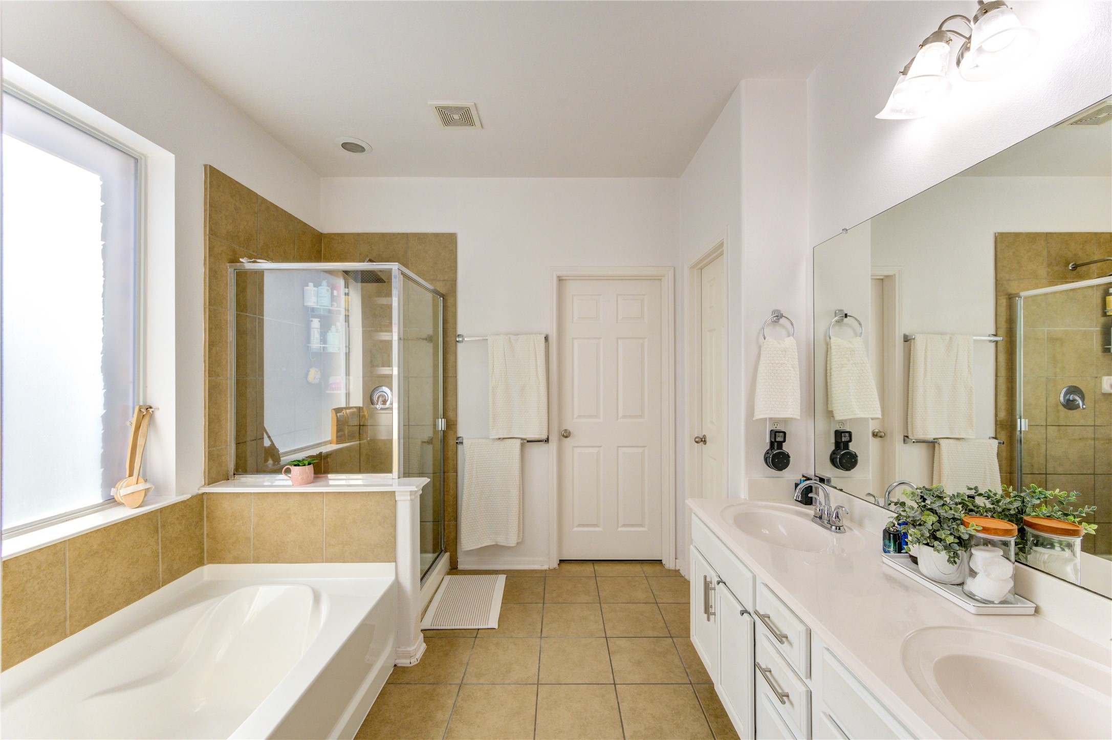 25210 Hazel Ranch Drive Katy, TX 77494 - Photo 24 of 45 a spacious bathroom with a tub sink shower and mirror