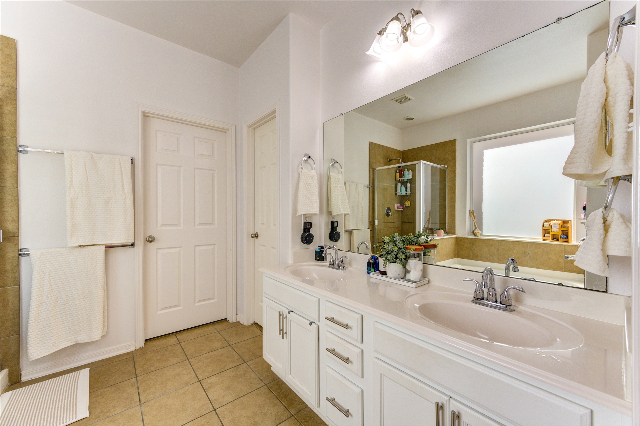 25210 Hazel Ranch Drive Katy, TX 77494 - Photo 25 of 45 a bathroom with a double vanity sink mirror and double