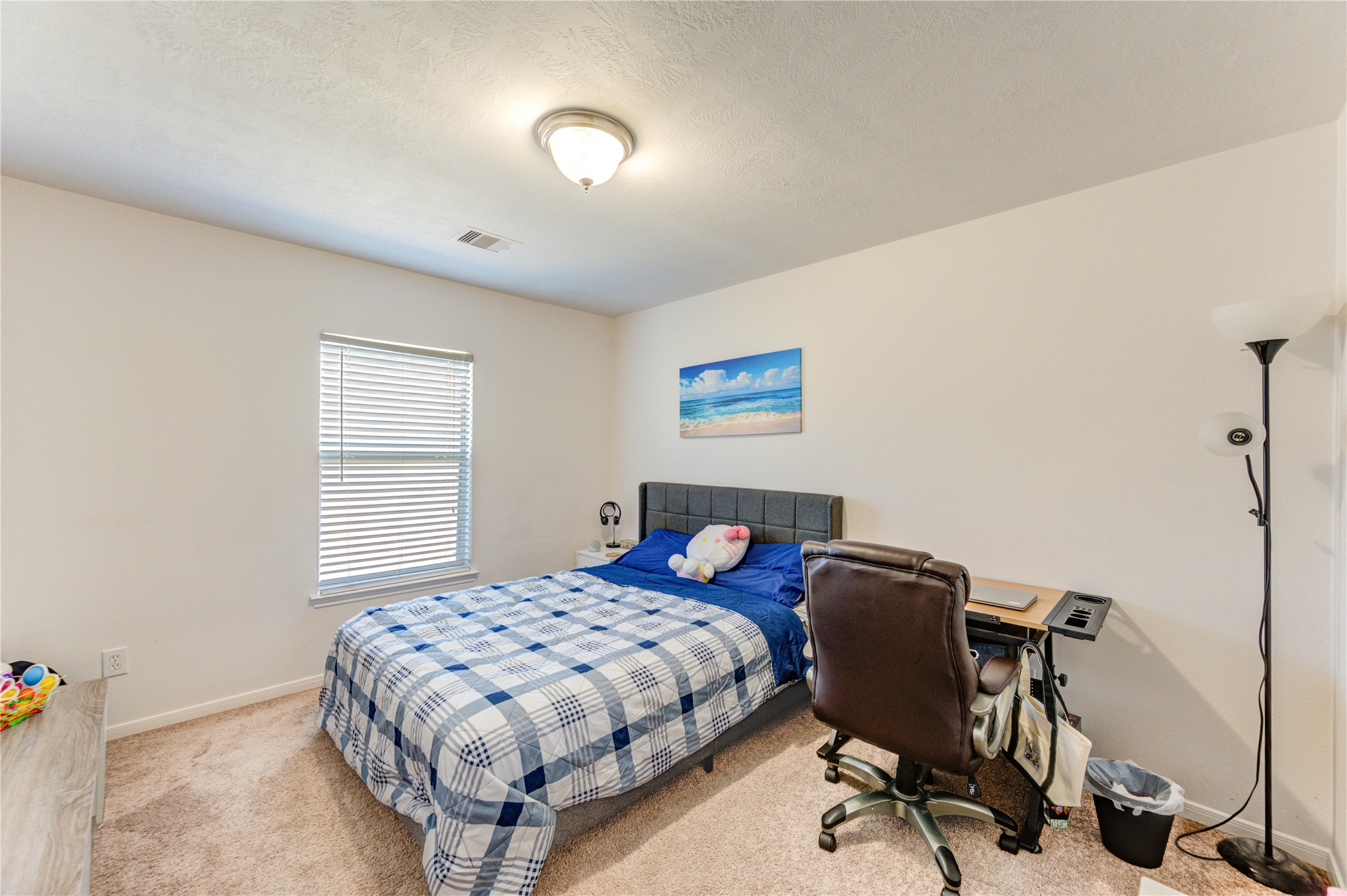 25210 Hazel Ranch Drive Katy, TX 77494 - Photo 27 of 45 a bedroom with a bed and a desk