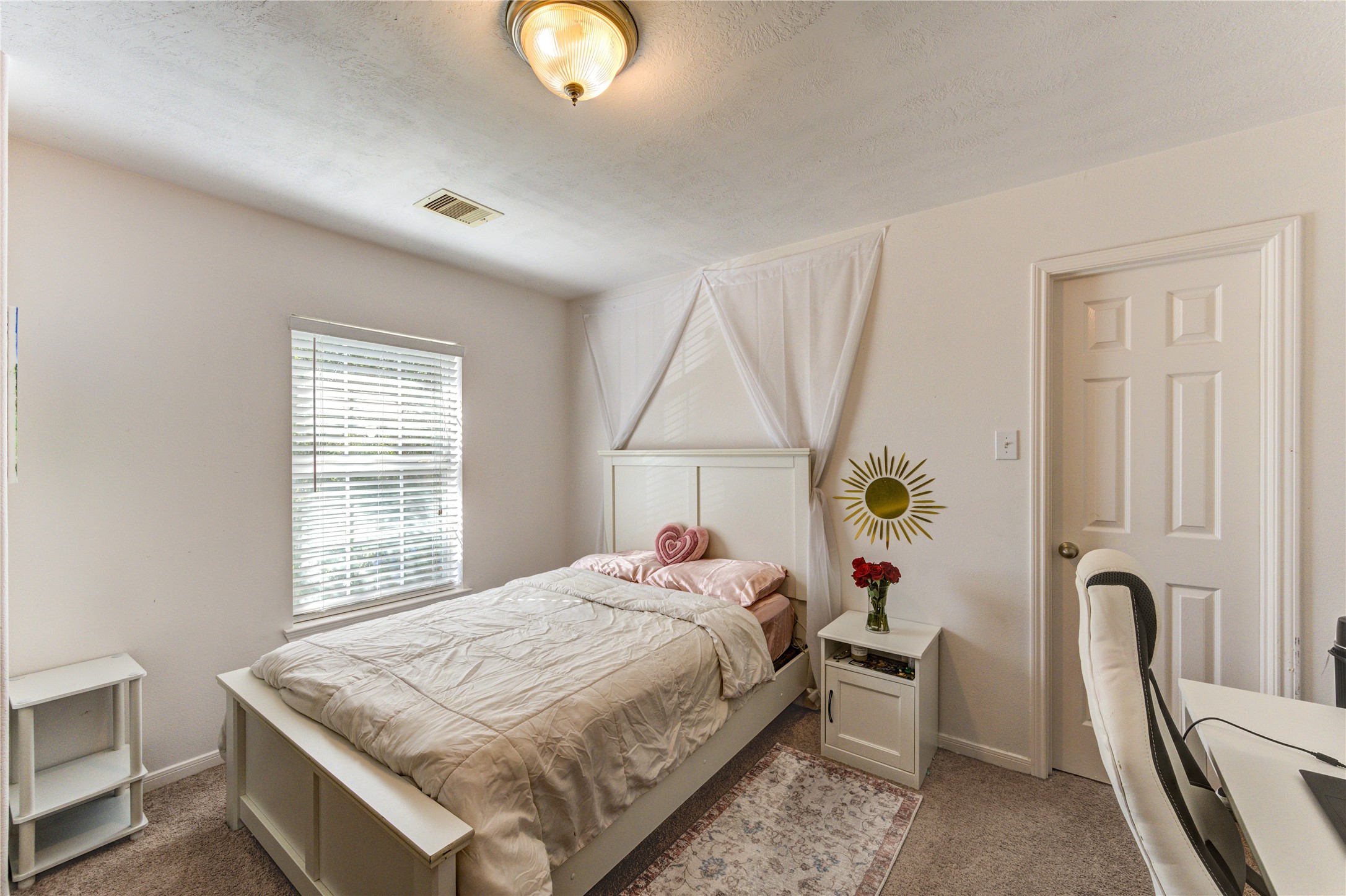 25210 Hazel Ranch Drive Katy, TX 77494 - Photo 37 of 45 a bed sitting in a bedroom next to a window