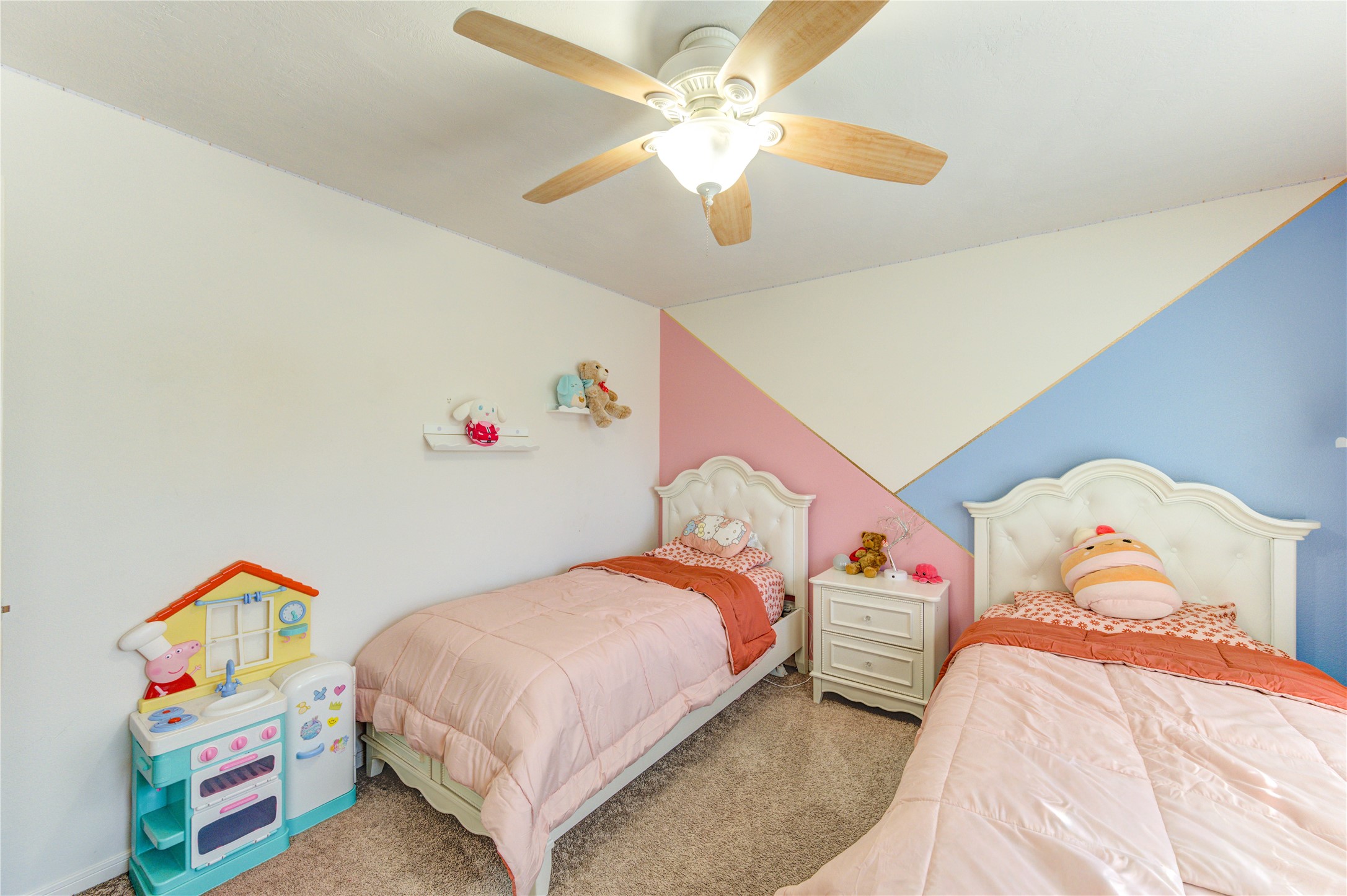 25210 Hazel Ranch Drive Katy, TX 77494 - Photo 39 of 45 a bedroom with bed and a chandelier