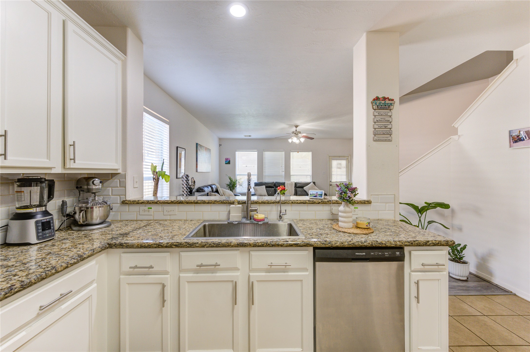25210 Hazel Ranch Drive Katy, TX 77494 - Photo 8 of 45 a kitchen with granite countertop a sink and cabinets