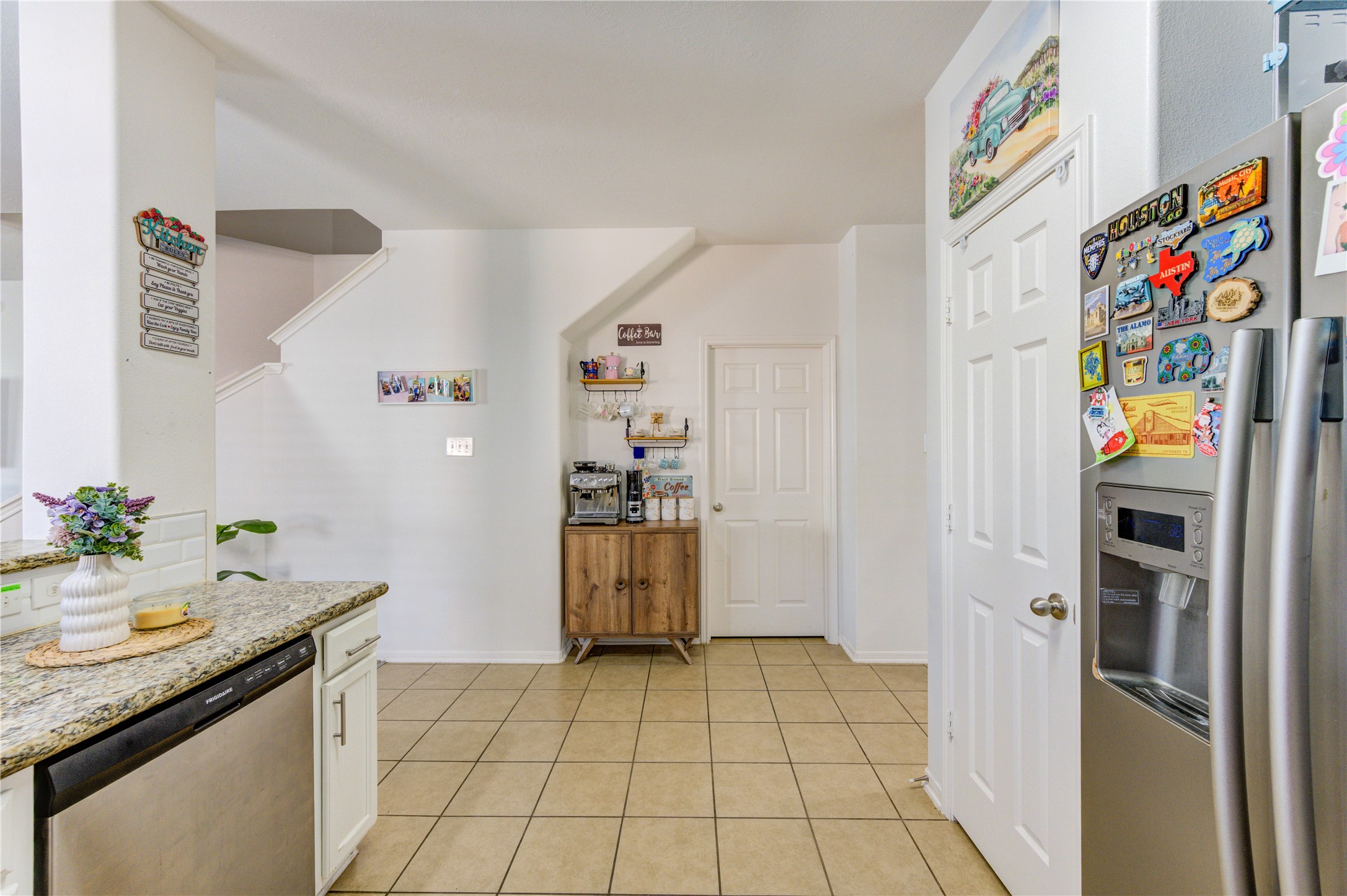 25210 Hazel Ranch Drive Katy, TX 77494 - Photo 9 of 45 a kitchen with a refrigerator and a sink