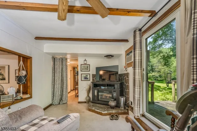 a view of a livingroom with furniture and windows