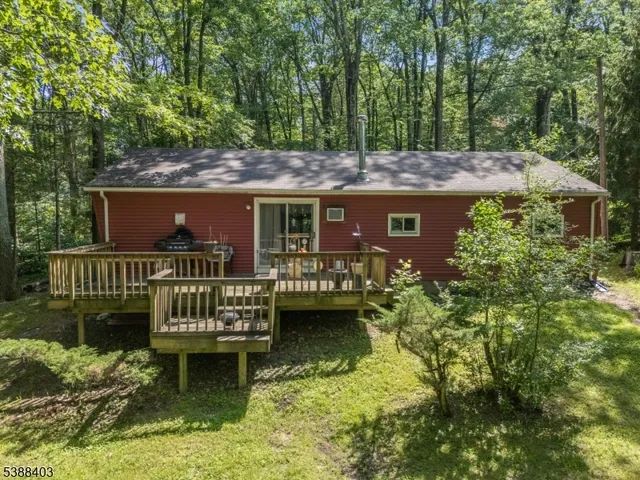 a aerial view of a house with swimming pool and garden view