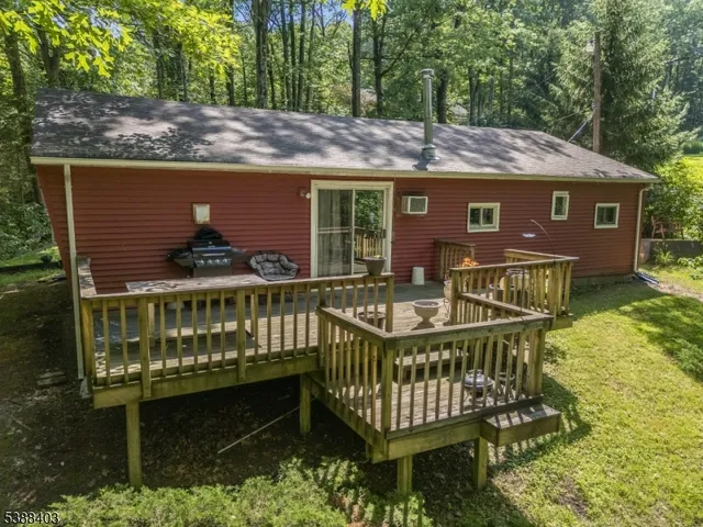 a view of a wooden house with a deck