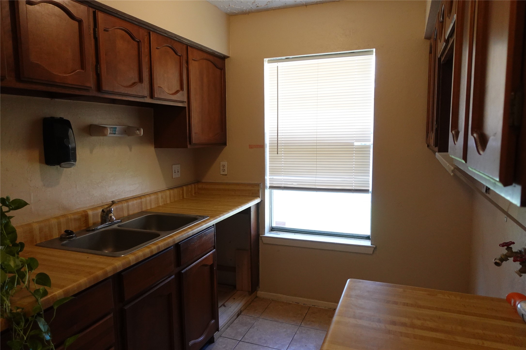 20027 Chipplegate Lane Humble, TX 77338 - Photo 15 of 32 a kitchen with a sink and a refrigerator