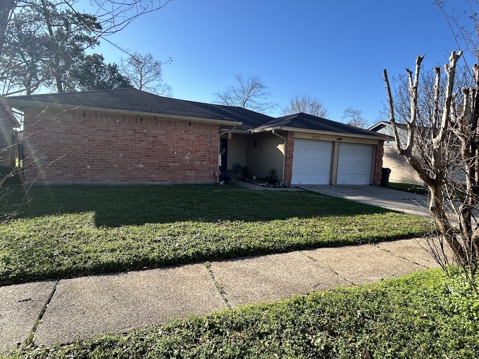 20027 Chipplegate Lane Humble, TX 77338 - Photo 2 of 32 a view of a house with a yard