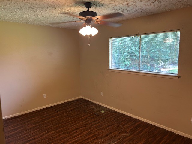 20027 Chipplegate Lane Humble, TX 77338 - Photo 27 of 32 a view of empty room with wooden floor and fan