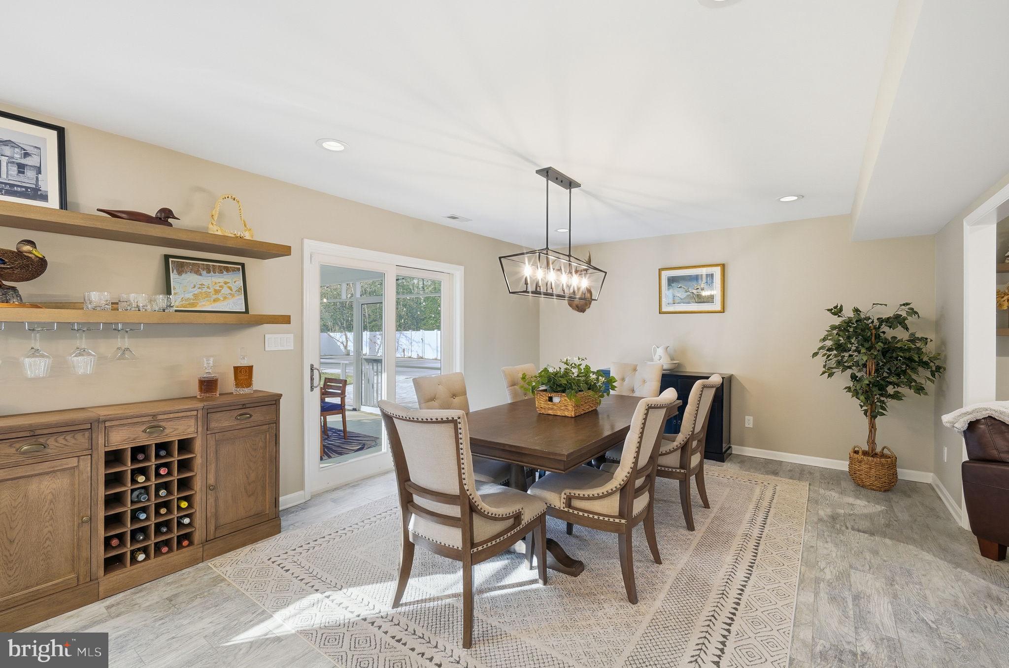 1410 Bennett Point Road Queenstown, MD 21658 - Photo 7 of 36 Dining room with slider access to porch