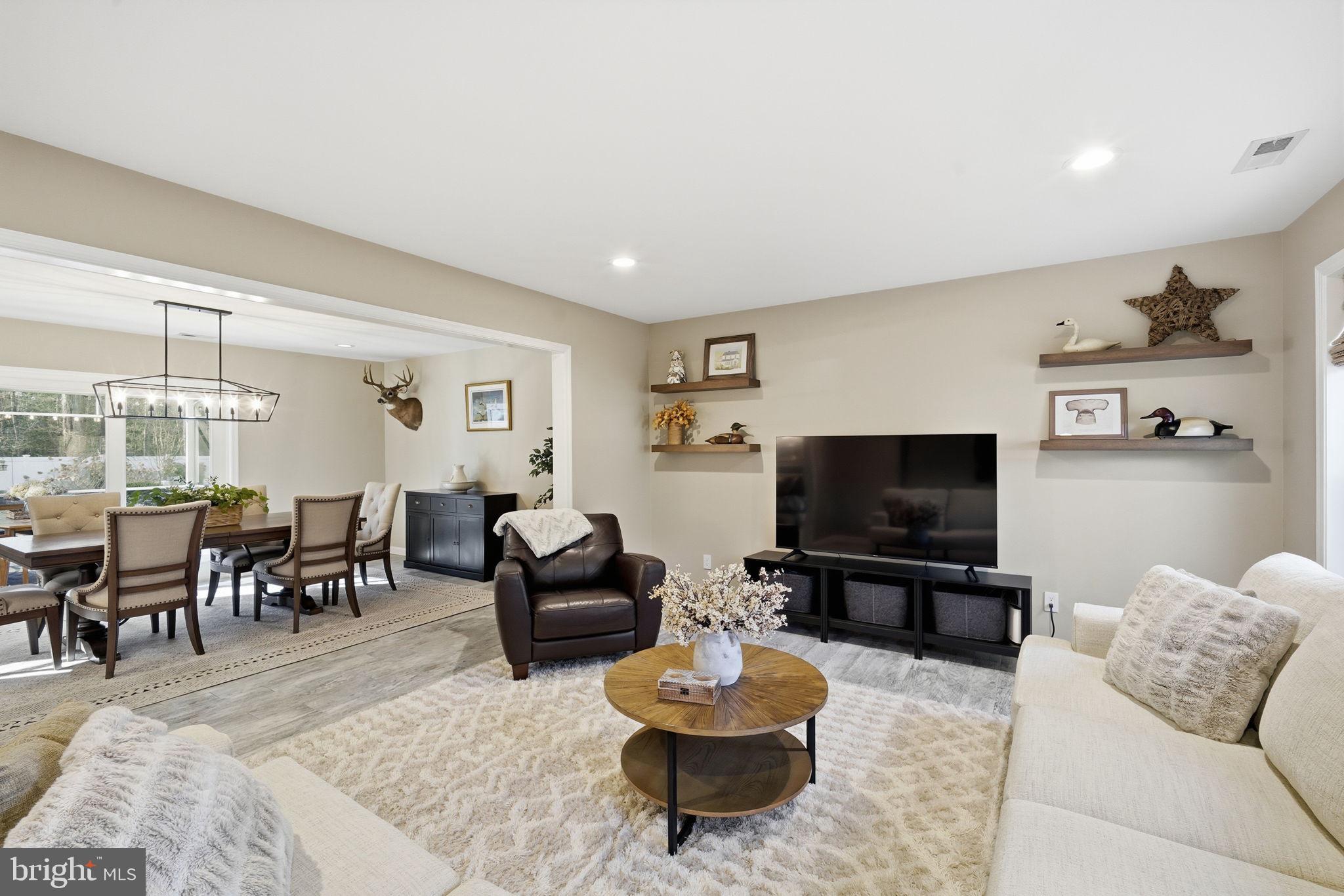 1410 Bennett Point Road Queenstown, MD 21658 - Photo 9 of 36 Seamless flow from family room to dining room