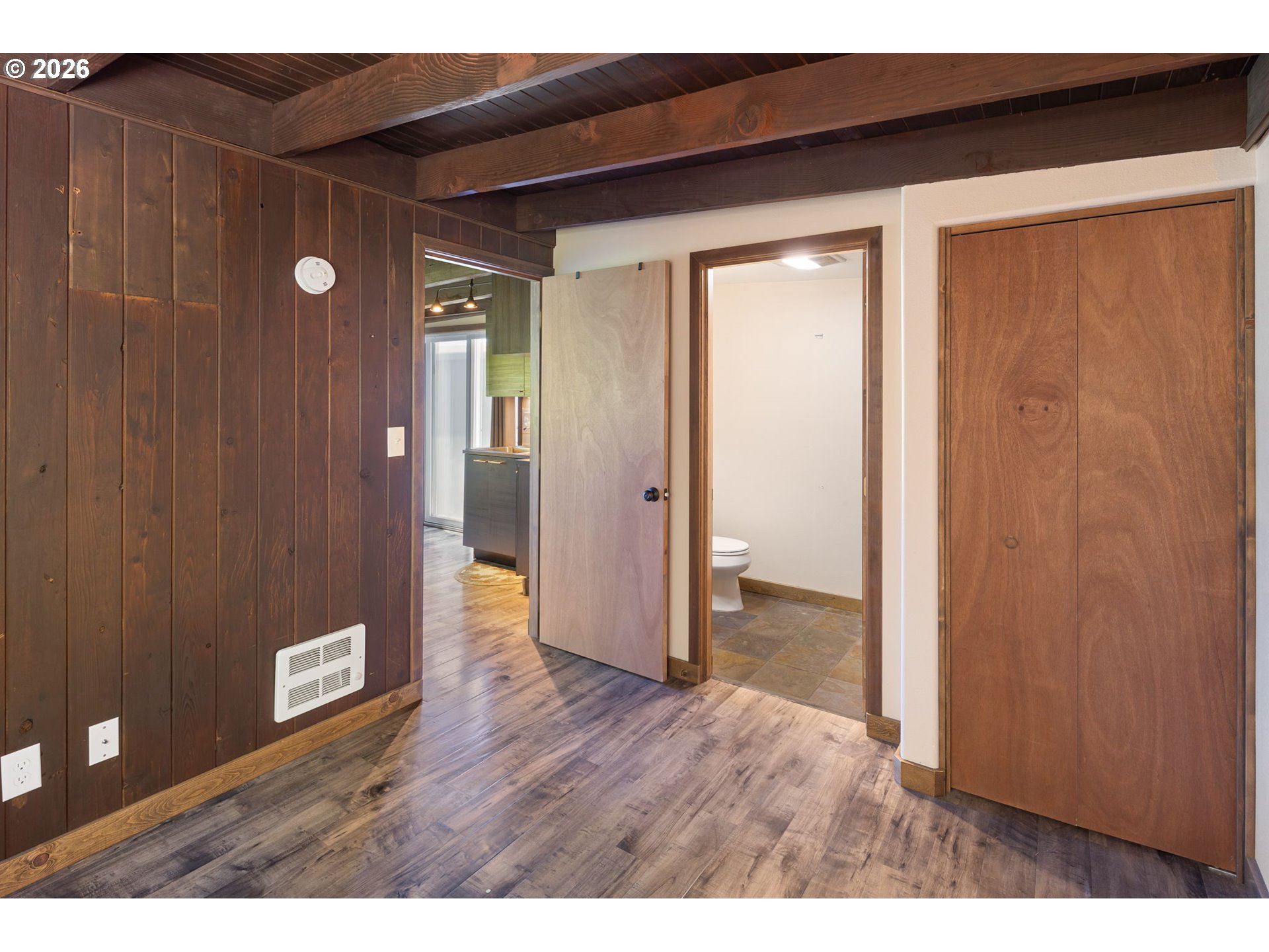 88481 1st Avenue Florence, OR 97439 - Photo 26 of 43 a view of a hallway with wooden floor