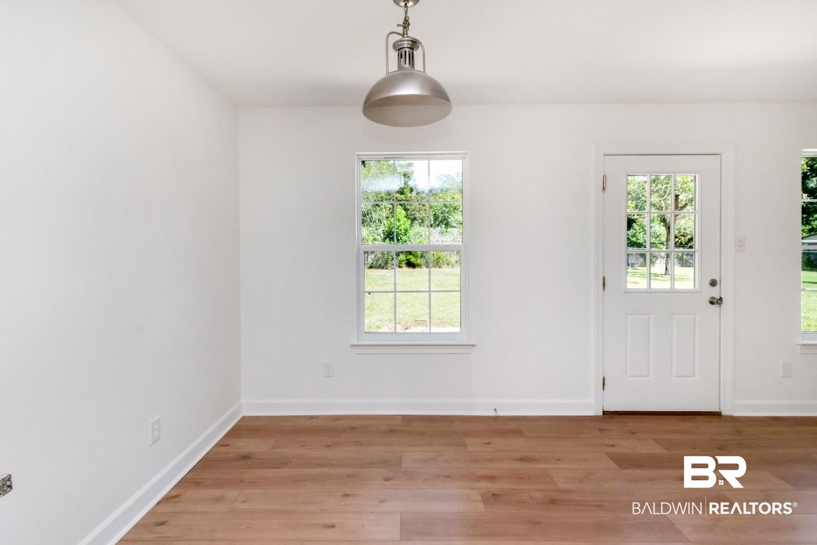 1611 Rochelle Street Mobile, AL 36693 - Photo 9 of 32 Entryway featuring healthy amount of natural light and wood finished floors