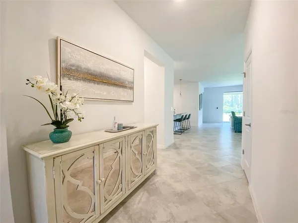 a view of hallway with wooden floor