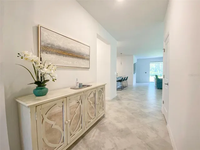 a view of hallway with wooden floor