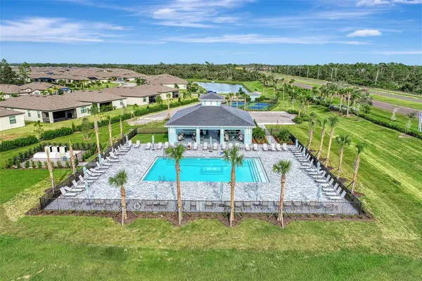 a view of a table and chairs under an umbrella