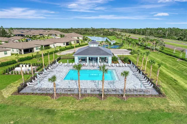 a view of a table and chairs under an umbrella
