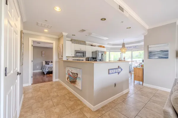 a kitchen with stainless steel appliances granite countertop a refrigerator and a stove
