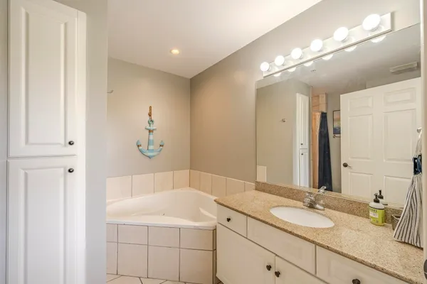 a bathroom with a sink a vanity and a mirror