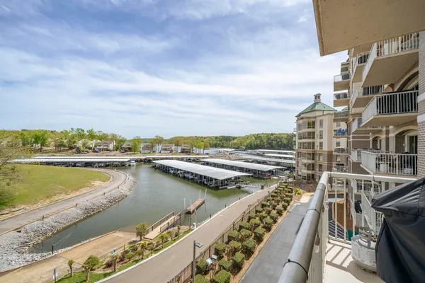 an aerial view of residential building and lake