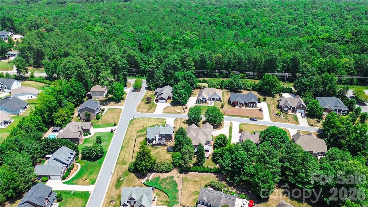 783 Sloan Street Denver, NC 28037 - Photo 38 of 44 an aerial view of residential house with outdoor space and trees all around