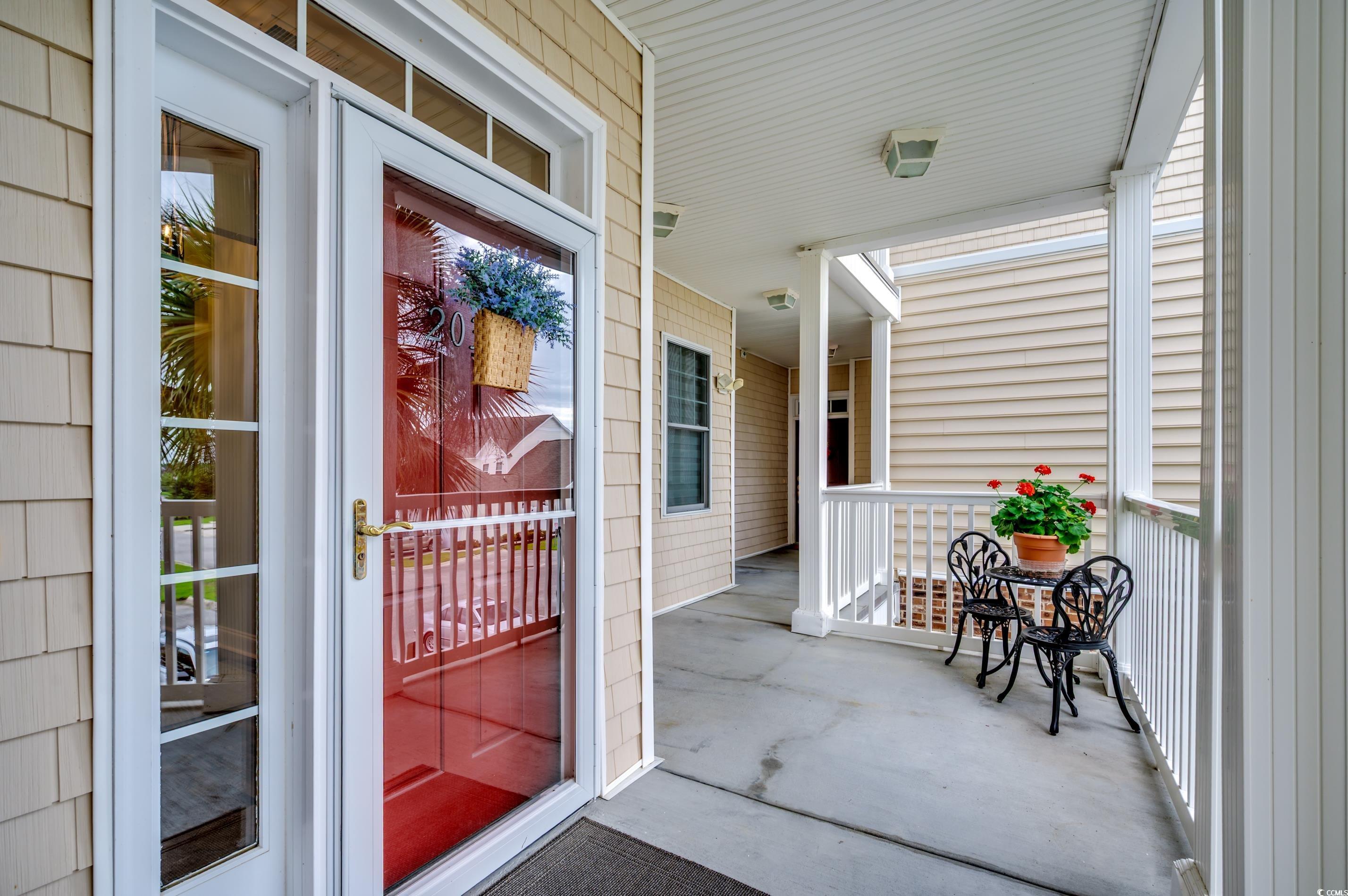 701 Pickering Drive, Unit 203 Murrells Inlet, SC 29576 - Photo 3 of 35 Well lit porches and easy elevator access from parking
