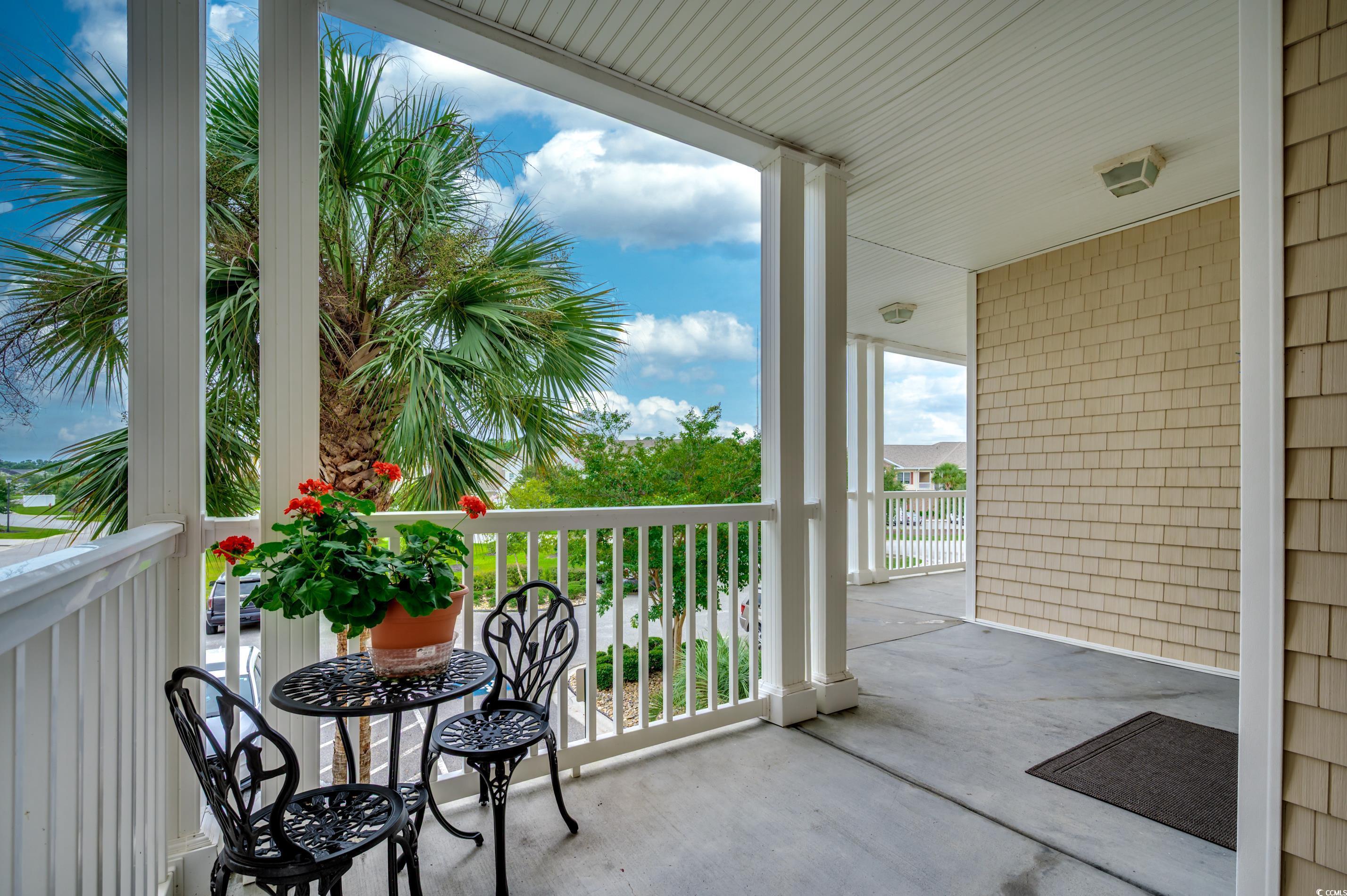 701 Pickering Drive, Unit 203 Murrells Inlet, SC 29576 - Photo 31 of 35 Covered and close to elevator. Covered stairways on each end of building.