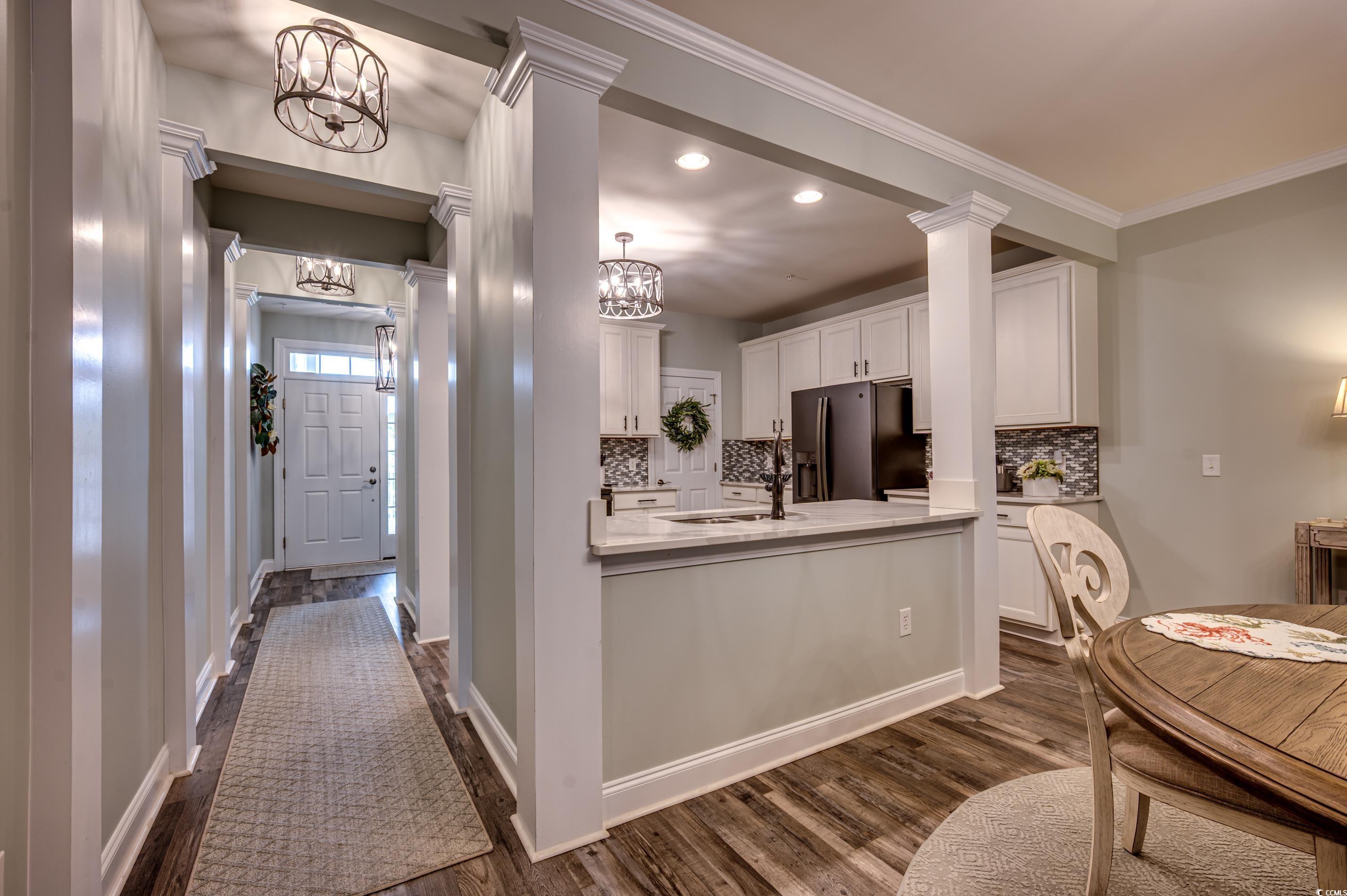 701 Pickering Drive, Unit 203 Murrells Inlet, SC 29576 - Photo 6 of 35 New slate appliances, quartz counters and tile backsplash