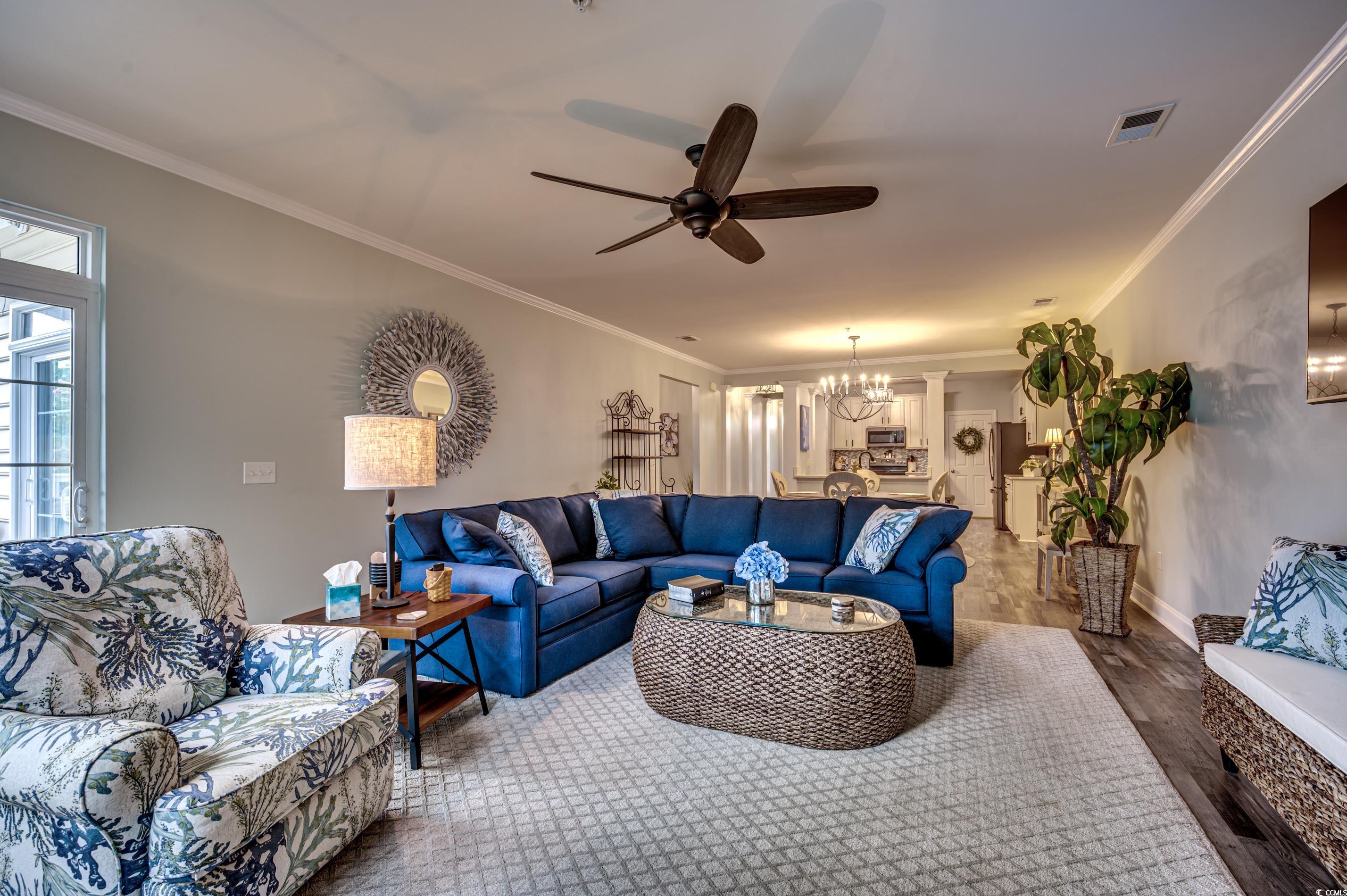 701 Pickering Drive, Unit 203 Murrells Inlet, SC 29576 - Photo 9 of 35 LVP flooring flows through main living areas