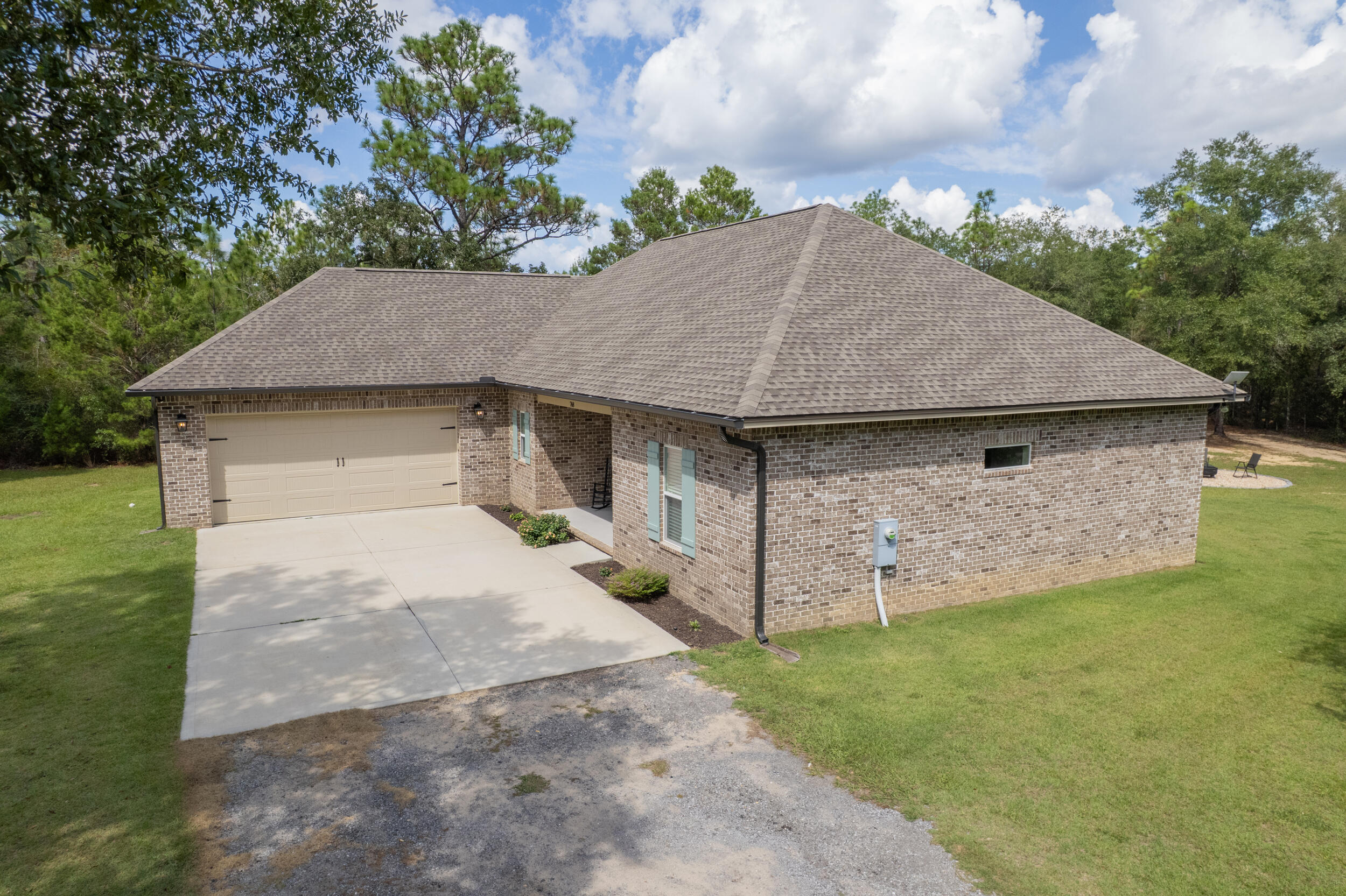 768 Long Road DeFuniak Springs, FL 32433 - Photo 105 of 106 a aerial view of a house with yard garage and trees